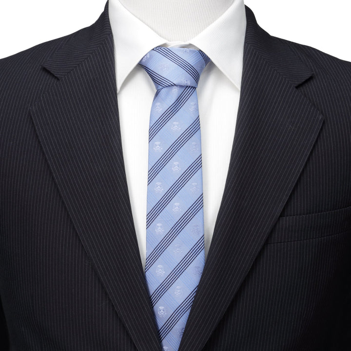 Star Wars Stormtrooper Blue Plaid Tie in light blue with dark blue diagonal stripes and small Stormtrooper helmet icons, worn with a white dress shirt and dark pinstriped suit jacket.