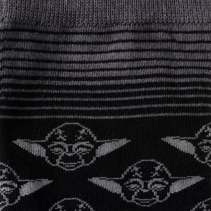 Star Wars Yoda Black Charcoal Dress Socks and Jedi Crest Lapel Pin Gift Set featuring black and gray striped socks with a repeating pattern of Yoda’s face.
