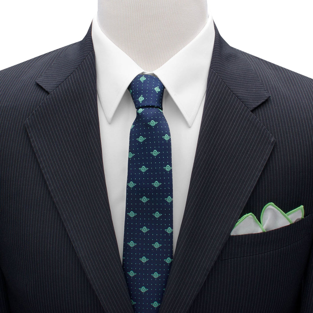 Star Wars Yoda Dotted Navy Tie in navy blue silk with green icons and white dots, worn with a white shirt, pinstriped suit jacket, and white pocket square.