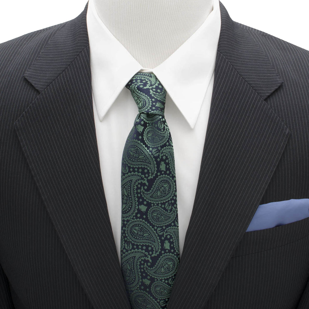 A dark green silk Star Wars Yoda Green and Blue Paisley Tie with small Yoda silhouettes, worn with a white shirt, pinstripe suit jacket, and blue pocket square.