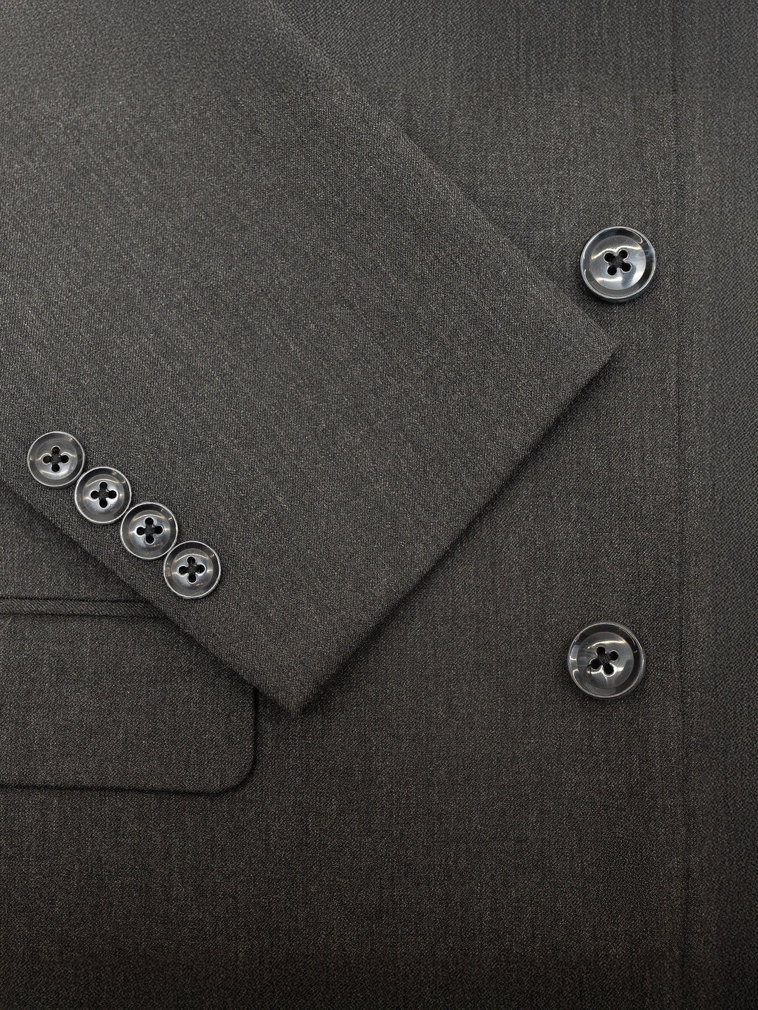 Close-up of the Karako Men charcoal suit jacket showcasing visible buttons on the sleeve and front, ideal for enhancing any wedding or formal event.