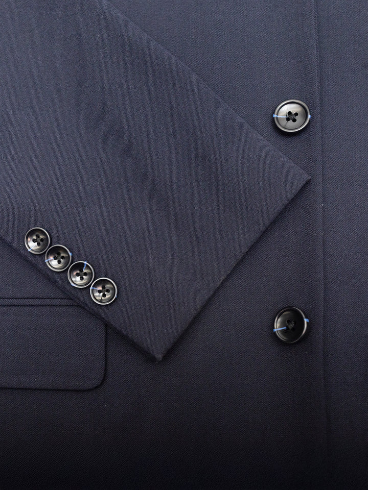 Close-up of a Mens Navy Suit by Karako Men, featuring buttons on the sleeve and front, ideal for a wedding or prom.