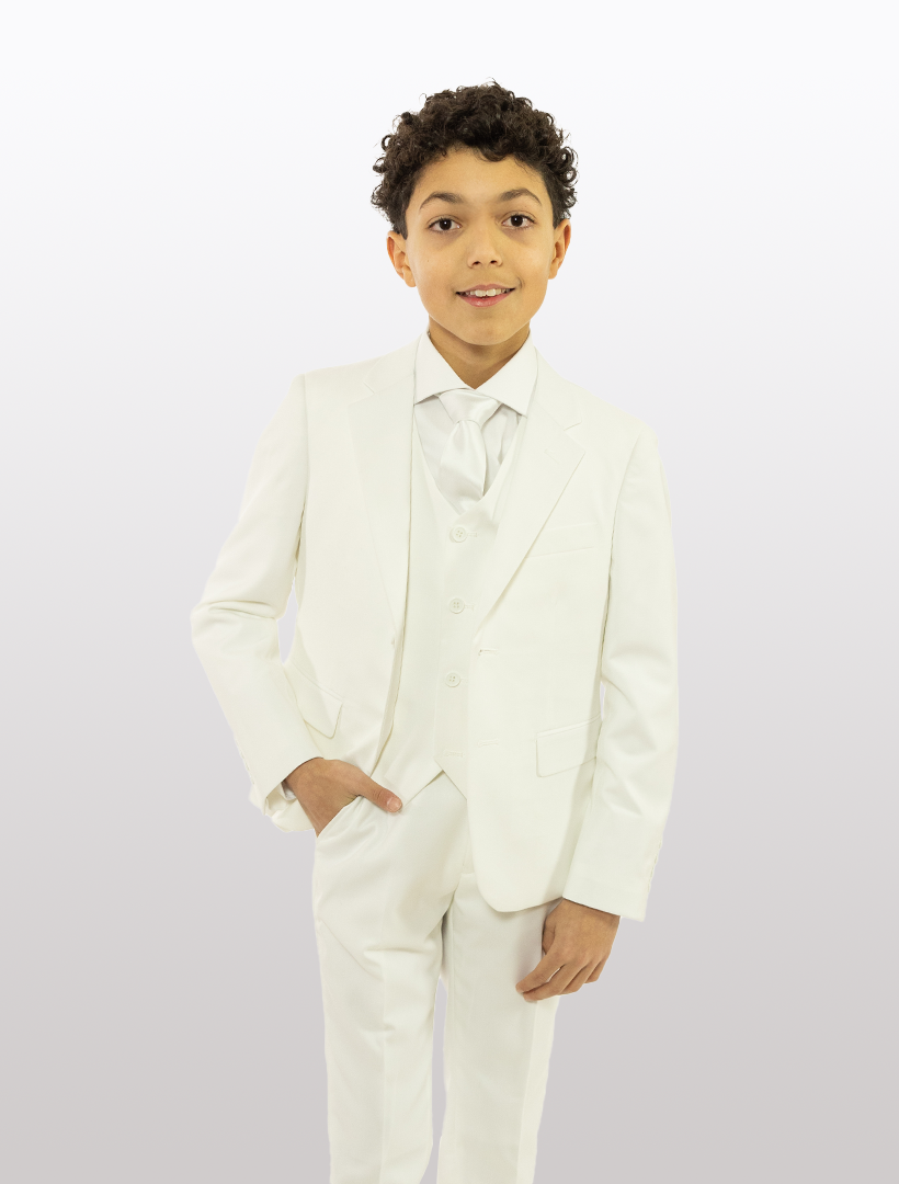 A young boy stands against a white background wearing a Karako Boys' White Classic Fit Vested Suit, complete with a tie and stretch armholes for comfort.