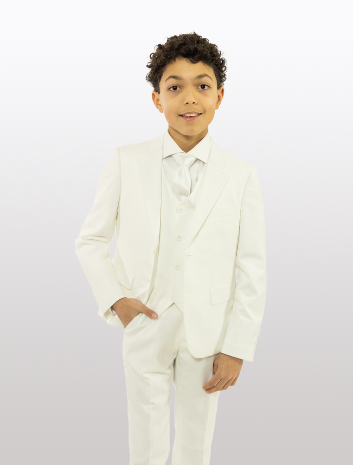 A young boy stands against a white background wearing a Karako Boys&