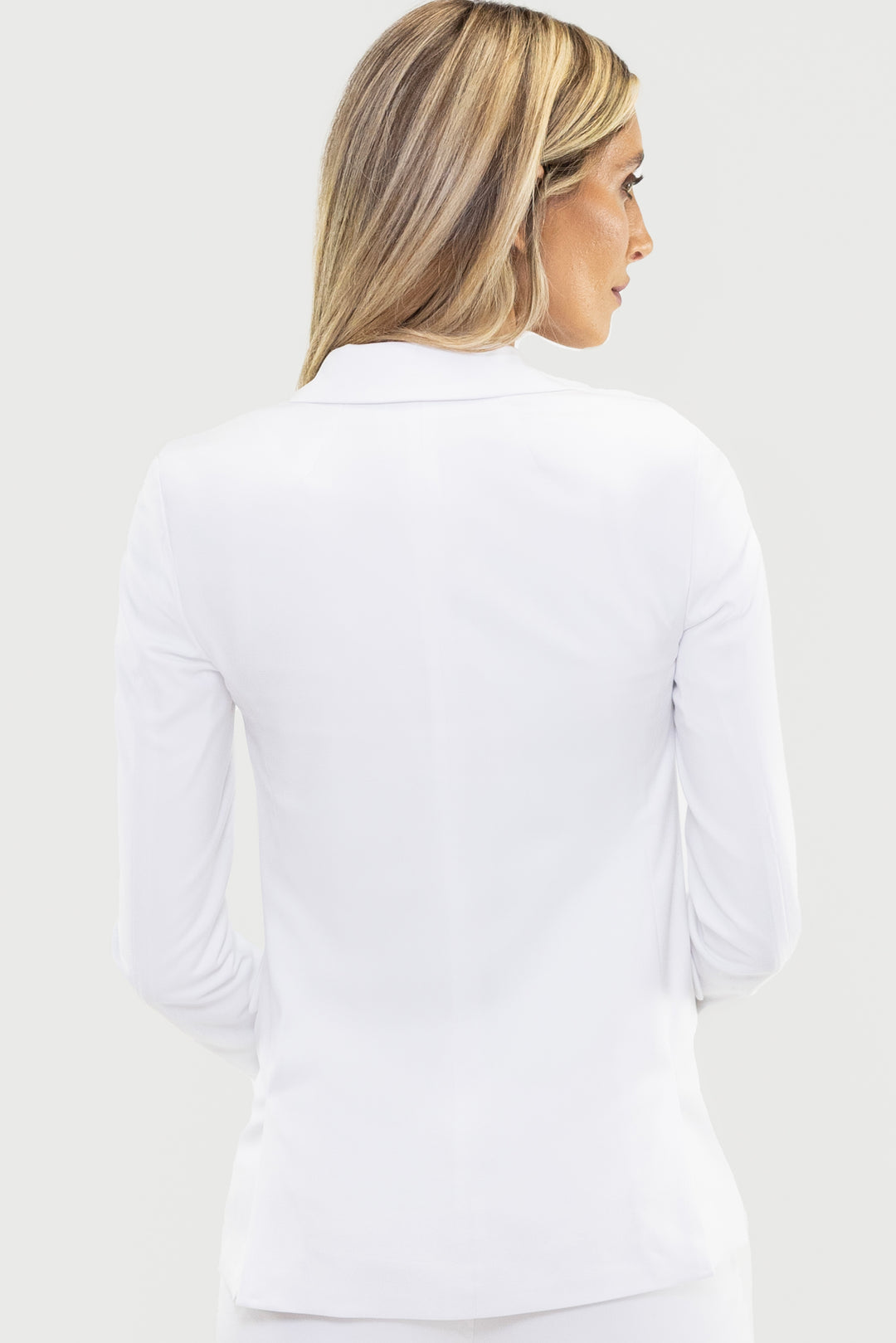 A woman with blonde hair is shown from the back, wearing a sophisticated Couture 1910 Women&