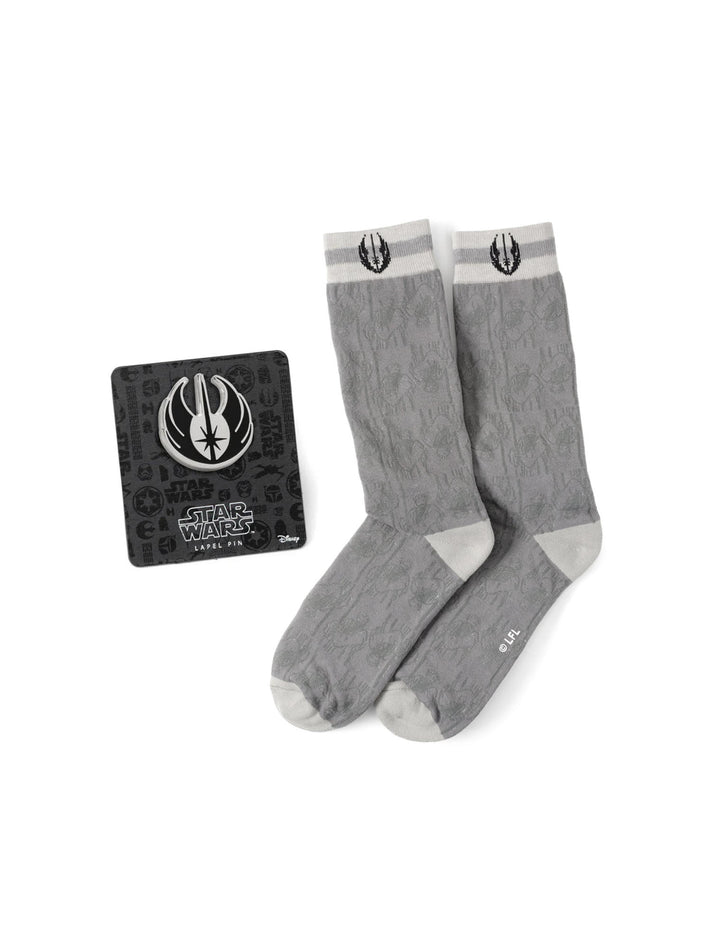 Star Wars Obi-Wan Kenobi Gray Socks and Lapel Pin Gift Set featuring gray socks with a Jedi Order symbol and a metal insignia pin on a display card.