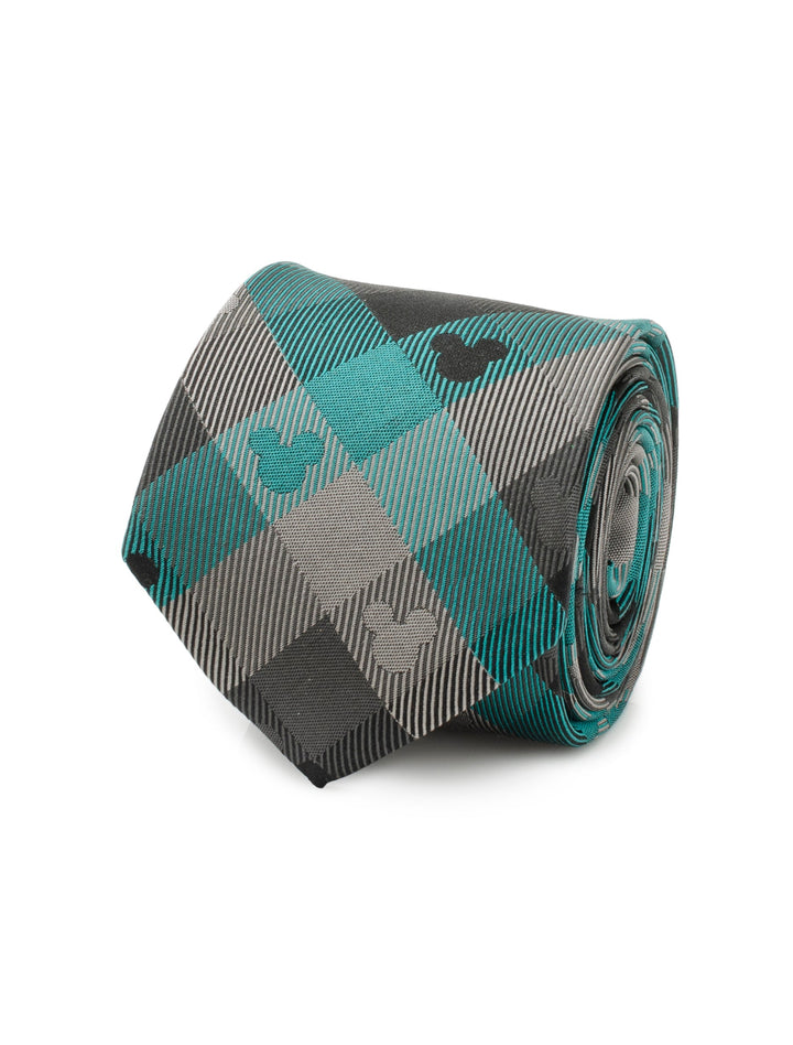 A coiled Disney Mickey Mouse Silhouette Teal Plaid Men’s Tie featuring a teal plaid pattern of grey and black with small mouse ear silhouettes.