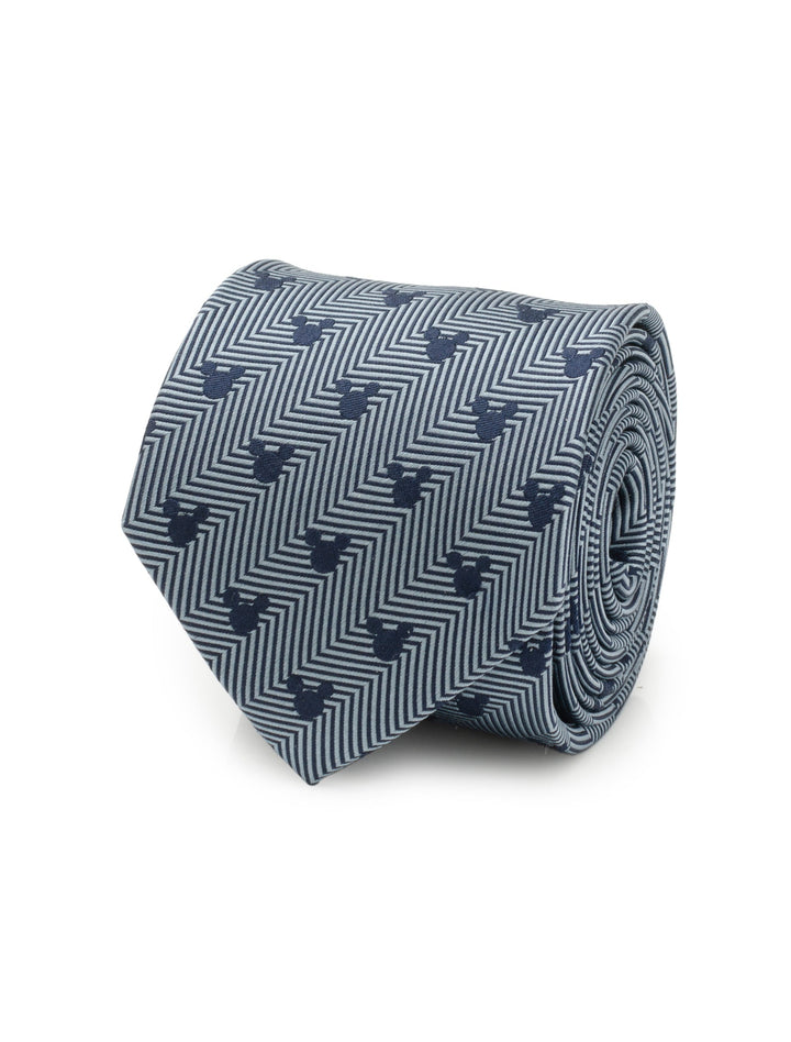 Disney Mickey Mouse Silhouette Blue Herringbone Men’s Tie in blue and grey silk with a rolled edge and a subtle pattern of small Mickey Mouse silhouettes.