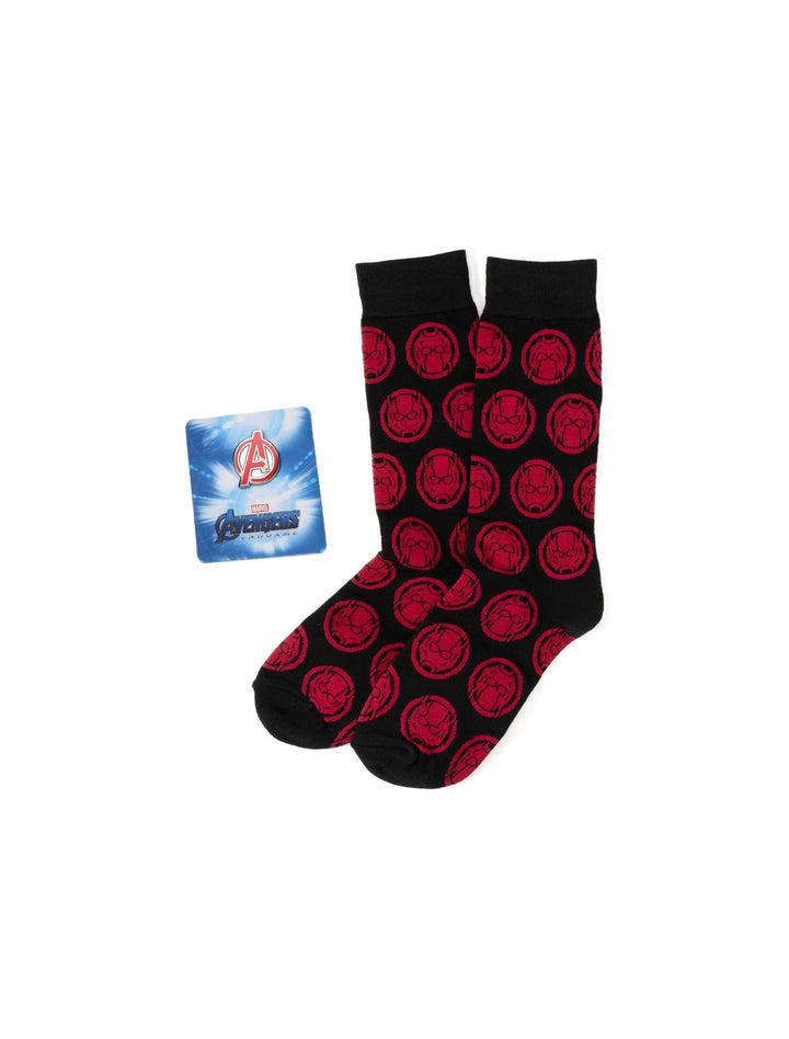 Black crew socks with a repeating red Ant-Man helmet pattern displayed next to an Avengers Endgame card as part of a Marvel Ant-Man Red and Black Gift Set.