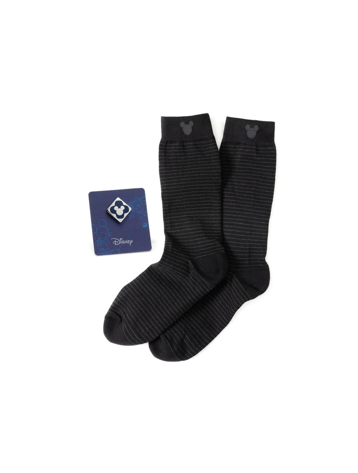 A Disney Mickey Mouse Silhouette Stripe Sock and Mickey Blue Lapel Pin Gift Set featuring black striped socks with Mickey silhouette cuffs and a square blue Mickey lapel pin.