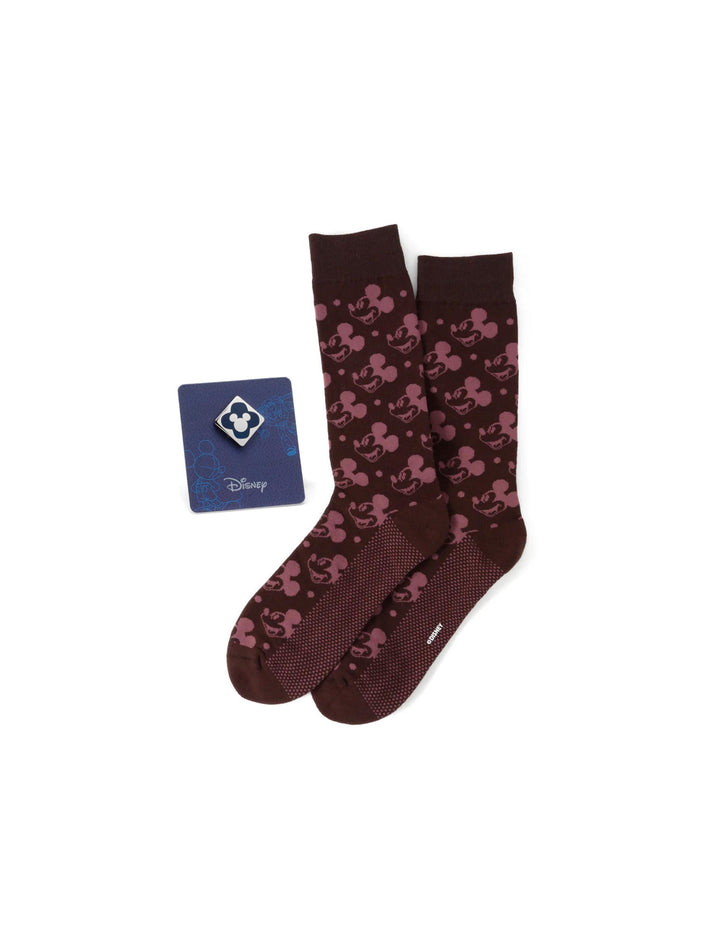 Disney Mickey Mouse Red Dot Socks and Blue Lapel Pin Gift Set featuring maroon socks with a repeating Mickey Mouse pattern paired with a blue Mickey Mouse lapel pin.