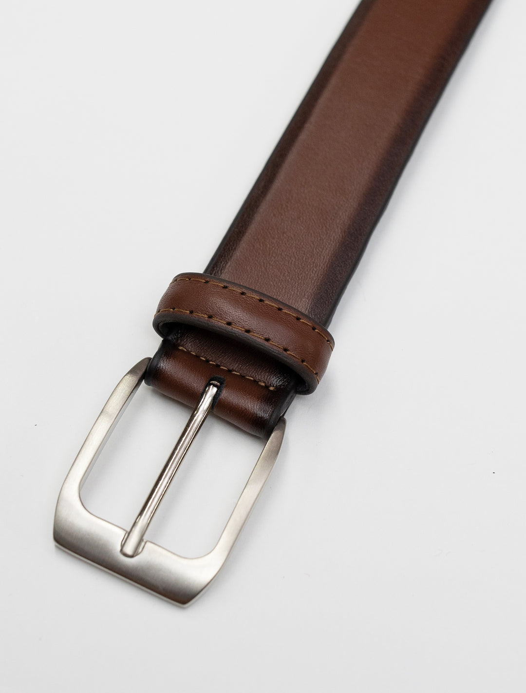 A stylish Cognac Waved Leather Frame Buckle Belt by Florsheim with a silver buckle.