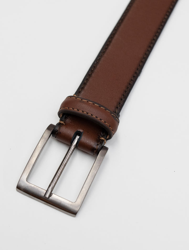 A stylish Cognac Stitch Edge Leather Frame Buckle Belt by Florsheim with a genuine leather strap on a white background.