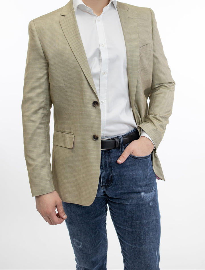 A man wearing a FUBU Slim Fit Beige Graph Check Sport Jacket blazer.
