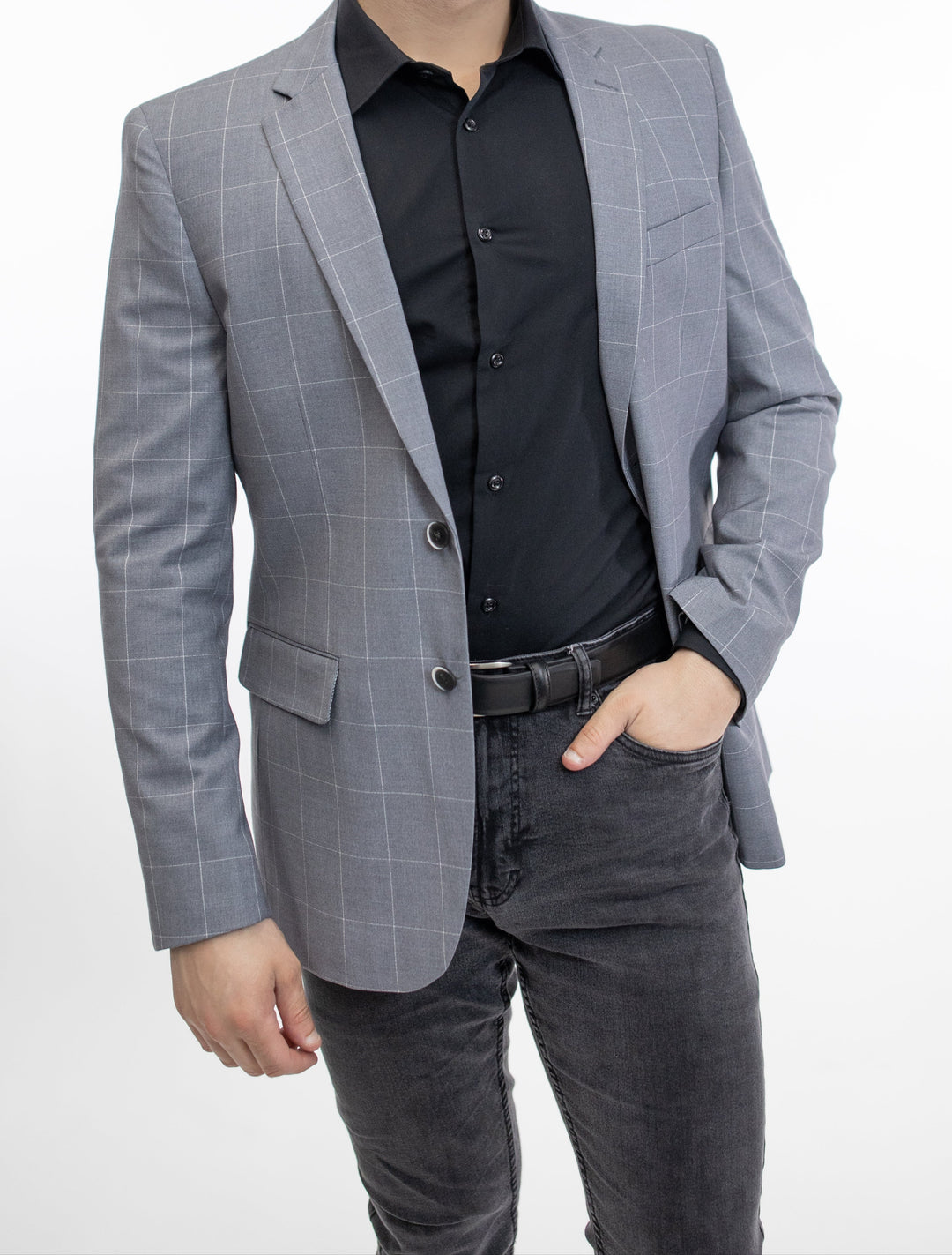A slim fit man in a FUBU Slim Fit Light Grey Windowpane Sport Jacket posing for a photo.